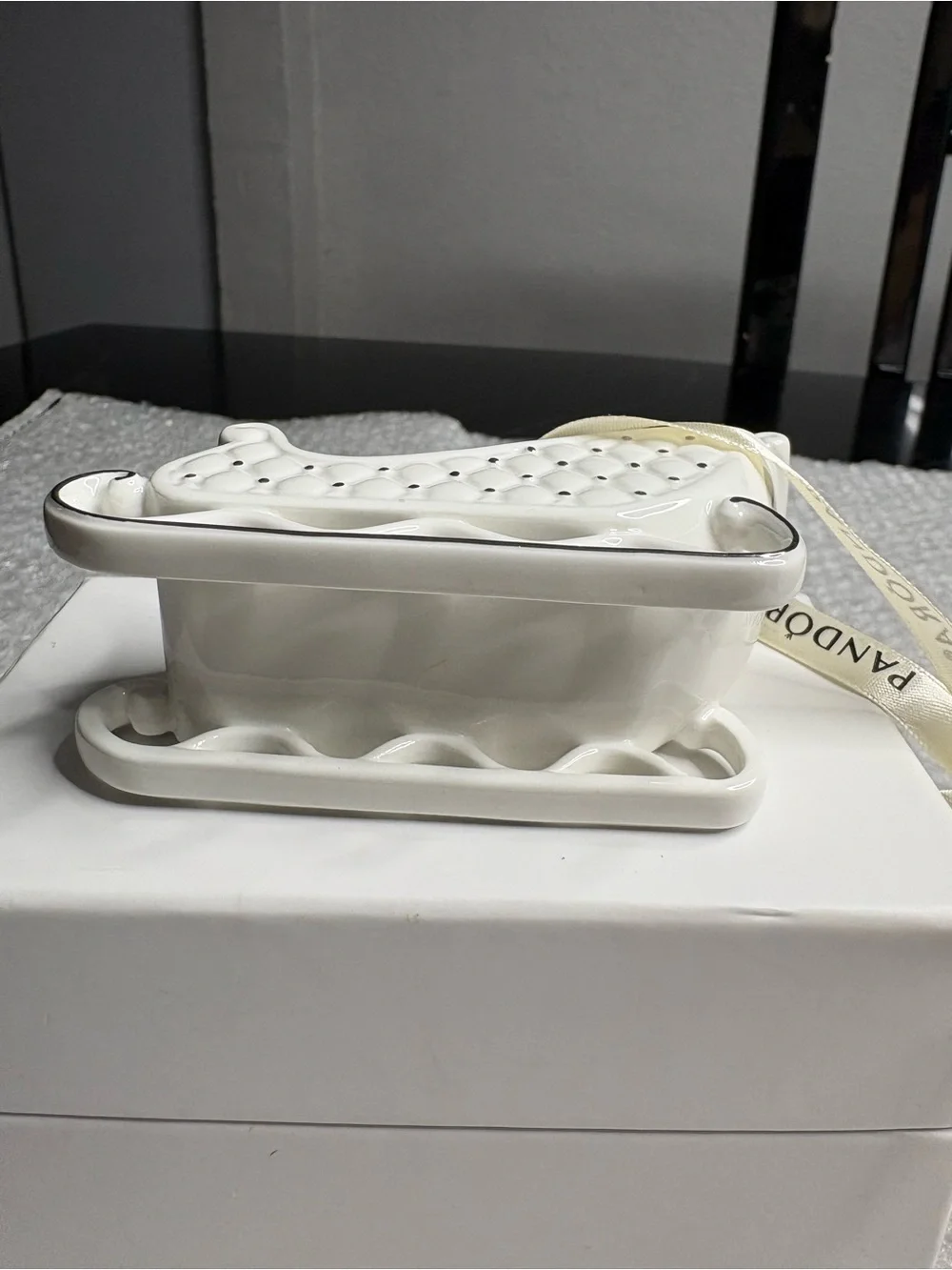Pandora white porcelain sleigh ornament
